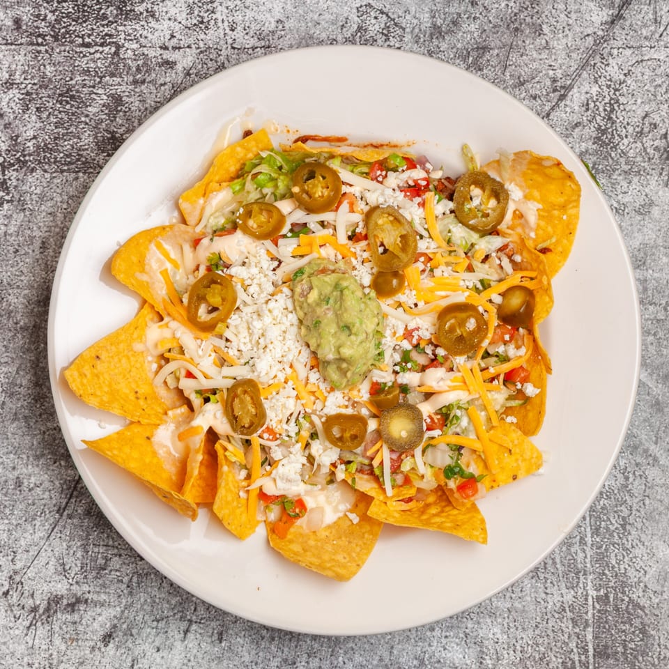 Luis Mexican Food & Grill's nachos with cheese, jalapeños, guacamole, and other toppings.